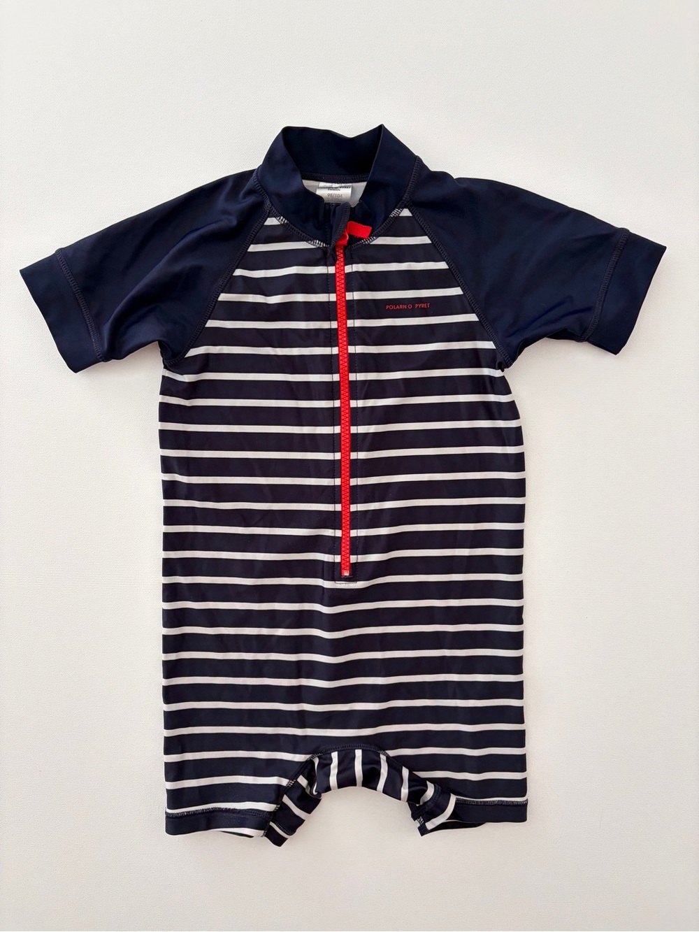 Polarn O. Pyret Navy and White Striped Kids One-Piece Swim Romper with Red Zip